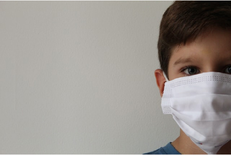 young boy with face mask